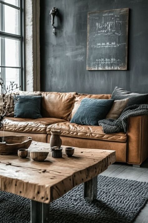 Bring an urban, industrial edge to your living room with exposed brick, metal accents, and rustic furniture. Use leather sofas, metal coffee tables, and vintage-inspired lighting to create a cozy yet edgy space that combines warmth and modernity. 🏙️🛋️ #IndustrialLiving #UrbanDecor #EdgyDesign Minimalist Industrial Interior Design, Industrial Boho Living Room, Living Room With Exposed Brick, Industrial Cozy, Boho Industrial Living Room, Eco Industrial, Industrial Chic Living Room, Leather Couch Living Room, Rustic Industrial Living Room