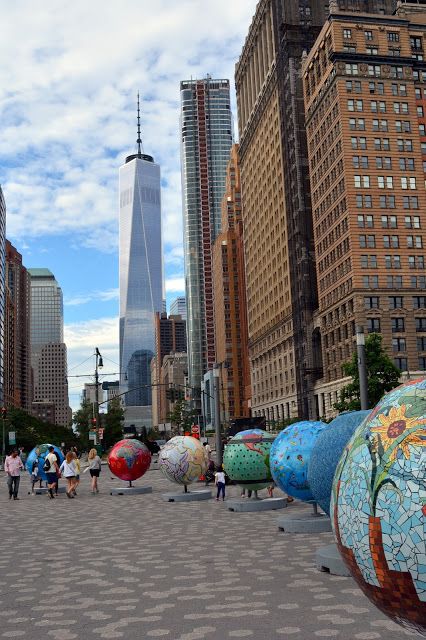 "Cool Globes" art exhibit in  Battery Park, Manhattan Battery Park Nyc, Nyc Billboard, New York Sightseeing, Travel Honeymoon, New York City Vacation, Dubai Skyscraper, Battery Park, Nyc Park, Nyc Aesthetic