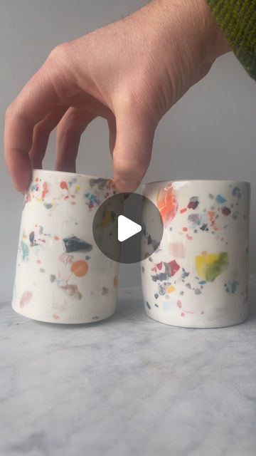 Adrien Miller on Instagram: "Making a terrazzo effect on porcelain slab cups.  I had a bunch of these dried up little chips of colored clay, so I sprinkled them onto puddles of wet slip on slabs to get them rehydrated while maintaining the crisp edges of the color flakes.  I forgot to film the other steps, but there are plenty of slab building videos out there, so here’s the unusual part of the process. Enjoy!
#terrazzo #porcelain #process #coloredclay #cups" Building Videos, Porcelain Slab, Clay Slip, Colored Clay, Pottery Techniques, Red Clay, Glazes For Pottery, I Forgot, Sprinkles