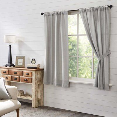 Create a timeless vintage appeal in your comfortable abode with our Burlap Dove Grey Panel Set. Crafted with our soft cotton burlap and finished with a standard hem fold at the bottom, this grey curtain set brings a relaxed, rustic ambiance to any living room, dining room, family room, or guest bedroom while adding warmth and welcome to your windows. Change up the look and let in natural light with the matching tie-backs. This vintage curtain set can be gently machine washed and ironed for easy Burlap Lights, Burlap Window Treatments, Farmhouse Living Room Curtains, Grey Curtain, Farmhouse Style Curtains, Vhc Brands, Vintage Curtains, Grey Panels, Grey Curtains