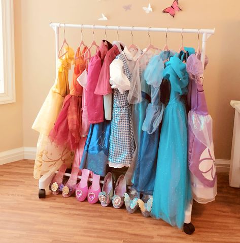 PRICES MAY VARY. Comes with 10 Kids velvet hangers! Velvet hanger color may vary slightly Use with or without wheels (included) CGR-10P Features: -Rack includes 10 velvet hangers. -Free-standing short garment rack perfectly sized to organize children's clothing. -Store, hang, and organize kid's clothes. -End caps keep clothing securely in place. Product Type: -Nursery Hanger. Intended Use: -Skirt/Pants/Tie/Belt/Suit/Dress/Shirt. Primary Material: -Metal. Dimensions: Overall Height - Top to Botto Princess Dress Organization, Kids Dress Up Area, Dress Up Storage Diy, Toddler Dress Up Station, Dress Up Storage Ideas, Kids Dress Up Storage, Play Closet, Dress Up Rack, Small Room Girl