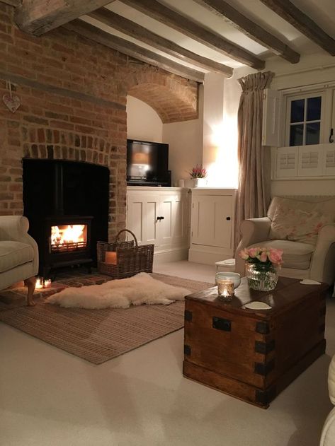 Hygge Tv Room, Cosy Farmhouse Exterior, French Gite Interior, Red Brick Chimney Living Room, Cosy Den Ideas, Red Brick House Interior Living Rooms, Cosy Basement Ideas, Red Brick Fireplace Decor Ideas, Brick Chimney Living Room