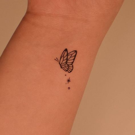 Fine line butterfly tattoo placed on the wrist. 3 Butterfly Tattoo Small, 3 Butterfly Tattoo, Butterfly Tattoo Small, Tiny Butterfly Tattoo, Butterfly Tattoos On Arm, Simple Wrist Tattoos, Cute Tattoos On Wrist, Butterfly Wrist Tattoo, Simple Tattoos For Women