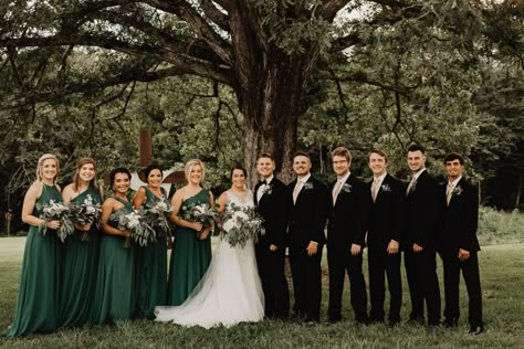 Black Suit Green Bridesmaid, Forest Green Bridesmaid And Groomsmen, Emerald Green Dress Wedding Party, Evergreen Bridesmaid Dresses With Groomsmen, Dark Green Bridesmaid Dresses With Groomsmen, Pine Color Bridesmaid Dresses, Black And Green Wedding Groomsmen, Black Tux Green Bridesmaids, Green Bridesmaids Black Groomsmen