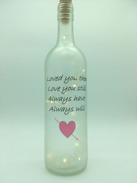 Pin by BespokeByBex on Light up bottle lamps | Valentines wine bottles, Wine bottle stickers, Wine bottle crafts Valentines Wine Bottle Crafts, Recycle Bottles, Upcycle Bottles, Wine Bottle Stickers, Diy Spring Crafts, Bottle Designs, Light Up Bottles, Bottle Ideas, Wedding Bottles