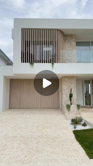 HAAUS.® on Instagram: "Who is ready? HAAUS.5 is complete and we are literally weeks away from sharing all the details with you. Stay tuned, this one is going to be game changing! 🍃Builder: @uniquecustombuilders 🍃Cladding: @deco_australia 🍃Battens: @deco_australia 🍃Driveway: @ambertiles 🍃Fence: @deco_australia 🍃Feature Stone: @veneerstoneaustralia 🍃Garage Door: @racgaragedoors 🍃Pavers: @ambertiles 🍃Landscaping: @modern_earth_landscapes 🍃Door Handles: @designerdoorware #haaus5 #dreamhome #facade" Modern House Exterior With Garage, Exterior Cladding Australia, Australian Modern House, Modern Front House Design, Front Facade Australia, Stone Cladding Exterior Modern, Beach House Exterior Australian, Cladding House Exterior Australia, Beach House Driveway