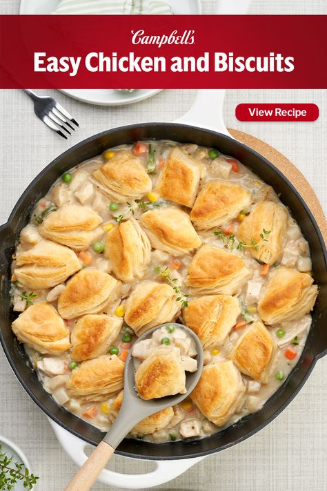 This Easy Chicken & Biscuits recipe only takes 5 minutes to prep, making it perfect for Easter, and it's also a great way to use up leftover chicken or turkey! Easy Chicken & Biscuits is like pot pie in a skillet! While the oven is heating, quickly simmer chicken and vegetables in Condensed Cream of Potato Soup- the soup makes a rich and creamy sauce that brings the filling together. Then, right in the skillet, just top the filling with refrigerated biscuits bake until golden brown. Meals With Chicken Stock, Campbells Chicken Pot Pie Recipe Easy, Sympathy Food Meals, Easy Chicken Biscuit Casserole, Campbells Chicken Pot Pie Recipe, Chicken Pot Pie With Grands Biscuits, Chick Pot Pie Recipes, Campbells Soup Chicken Pot Pie Recipe, Dinner Ideas With Canned Biscuits