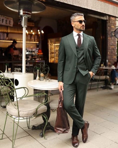 𝐌𝐑𝐆𝐔𝐈𝐋𝐃 on Instagram: "Canary Wharf ✨  Elevate your style with a tailored slim fit forest green three piece pinstripe men’s suit. The pinstripe pattern adds a touch of sophistication to the rich forest green hue, creating a harmonious blend of modern and classic. The peak lapels enhance its timeless appeal, making it ideal for formal events. This ensemble exudes confidence and refinement, allowing you to stand out with a distinctive and sophisticated look. Whether for upscale gatherings or special occasions, this suit showcases your impeccable taste and individuality.  #mrguild #sizebox #groom #wedding #menswear #mensfashion #fashion #menstyle #style #mensstyle #men #streetwear #fashionblogger #streetstyle #menfashion #instafashion #menwithstyle #mensclothing #instagood #model #mens Forest Green Suit Men, Men Wedding Suits Modern, Green Pinstripe Suit, Modern Suits Men, Three Piece Suit Mens, Wedding Menswear, Green Suit Men, Suited Men, Suit For Men Wedding