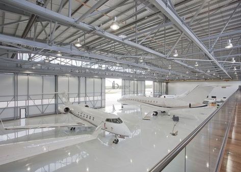 The steel space frame structure is suitable for the roof of the hangar. At present, the roof of the waiting hall, aircraft maintenance station and private hangar all use steel structure. On the one hand, it is convenient and flexible to install and disassemble, and on the other hand, it is low cost and long-lasting. Aircraft Hangar Design, Airplane Hanger, Hangar Design, Private Jet Plane, Aircraft Hangar, Airplane Hangar, Luxury Jets, Luxury Private Jets, Private Aircraft