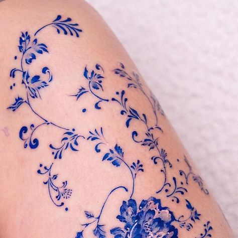 Oozy on Instagram: "Flowers in the thigh ❄️ . Done at @greystudiola . #oozy #oozytattoo #tattoo #kwadron" Oozy Tattoo Style, Blue Porcelain Tattoos, Blue China Tattoo White Porcelain, Blue Ink Flower Tattoo, Blue Ornamental Tattoo, Rosemailing Flowers Tattoo, Blue China Patterns Tattoo, China Plate Tattoo, China Blue Tattoo