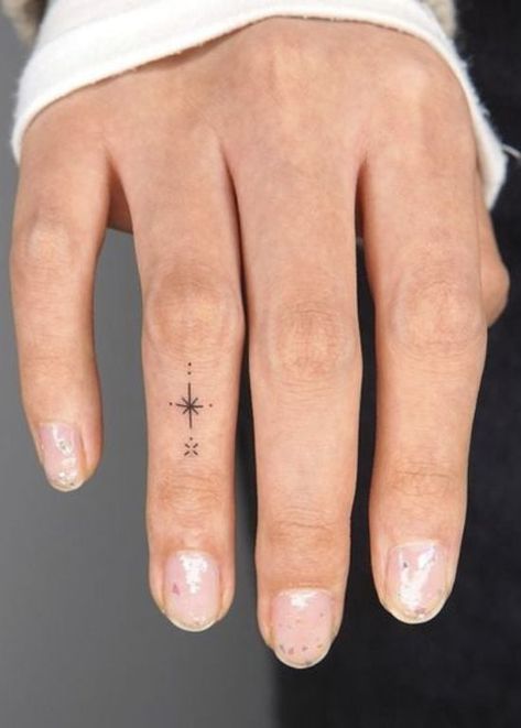 25 Beautiful and Meaningful Finger Tattoos for Women Colored Finger Tattoos For Women, Finger Tattoo Meaningful, Wrist And Finger Tattoos For Women, Intricate Finger Tattoo, Small Meaningful Finger Tattoos, Symbols For Finger Tattoos, Finger Tattoos And Meanings, Women Thumb Tattoos, Fine Finger Tattoos For Women