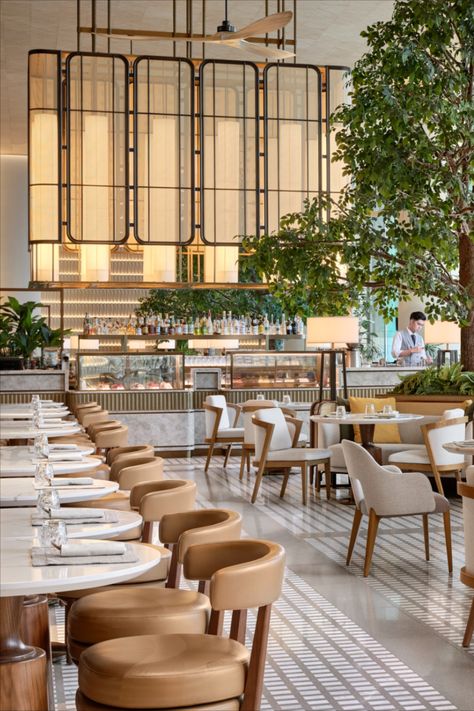 The 7.3m-high ceiling affords a panoramic view of the ocean while fans suspended from the high ceiling take inspiration from the verandas of the famous Repulse Bay Hotel. Bespoke screens, woven finishes, and abaca sheer blinds were commissioned for the space, inspired by the overarching nautical influence. Photography by Owen Raggett. #ArchitectureAndDesign #HospitalityDesign #ResortDesign #LuxuryResort #LuxuryHospitality#FullertonOceanPark #HongKong #FullertonStories #FullertonHotels Cafe Lobby, Restaurant Interior Design Modern, Luxury Hotel Lobby, Boho Restaurant, Hotel Restaurant Design, Luxury Hotels Lobby, Restaurant Design Inspiration, Modern Restaurant Design, Hotel Lounge