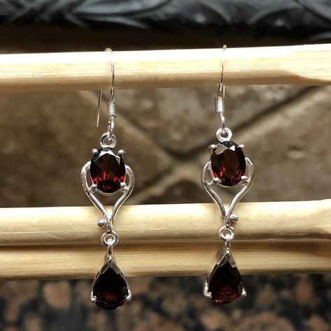 Handmade, natural product Stone: Pyrope Garnet Metal: 925 Solid Sterling Silver. Garnet is not a single mineral, but describes a group of several closely related minerals. Garnets come in a variety of colors and have many different varieties. However, the most widely-known color of Garnet gemstones is dark red. Red garnets have a long history, but modern gem buyers can pick from a rich palette of garnet colors: greens, oranges, pinkish oranges, deeply saturated purplish reds, and even some blues Red Gothic Earrings, Red Gem Jewelry, Dark Red Accessories, Dark Red Earrings, Pyrope Garnet, Gothic Earrings, Prom Jewelry, Red Jewelry, Garnet Jewelry