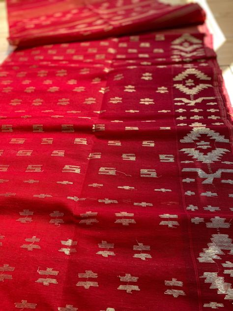 🌸 Hey everyone! 🌸 I am absolutely thrilled to share with you all the sheer elegance and beauty of original hand woven Dhakai Jamdani sarees! This saree includes * Red and Golden colour shiny tassel * Fall and piku done * Count: 60 * Half silk (Product colour may slightly vary due to photographic lighting sources or your monitor settings) Jamdani sarees are a true masterpiece of art, originating from the heartland of Bangladesh. Each thread is meticulously handwoven, resulting in breathtakingly intricate motifs and patterns that seem to come alive on the fabric. 🌺 This Jamdani sarees even more special is their lightweight and airy feel, making them perfect for any occasion, be it a wedding, a festive celebration, or even a casual day out. 💃✨ The softness of the fabric and the vibrant co Red Jamdani Saree, Jamdani Saree Dhakai, Cherry On The Cake, Dhakai Jamdani Saree, Golden Colour, Jamdani Saree, Beautiful Saree, Golden Color, Heartland