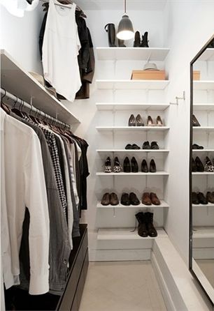 Walk-In Closets. Large or small, a walk-in closet is a room all its own. A high-quality door and drawers, installed accessories, finishes, lighting, and layout options create a custom-designed and organized space that is a joy to use every day. #walkincloset #walkclosetideas #closetideas Vanity In Closet Walk In Small, Small Walk In Wardrobe Organisation, Mini Walk In Wardrobe, Mini Walk In Closet Ideas Small Spaces, Deep Narrow Closet Ideas, Mini Walk In Closet, Krakow Apartment, Small Walk In Closet Design, Narrow Wardrobe