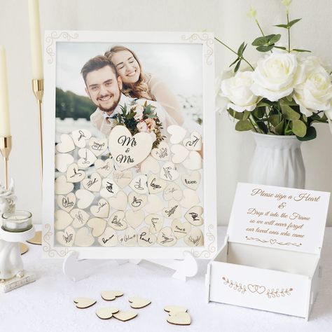 PRICES MAY VARY. Alternative Guest Book Wedding: You will get 1 drop frame guest book (15.7" x 11.8" x 0.67"), 1 wooden frame stand, 1 plywood box (6.3" x 4.9" x 2.7"), 1 large wooden heart (3"), 70 pieces small wooden hearts (1.4"), 1 Installation Instructions. It is a great idea to use instead of a traditional guest book, to create an unforgettable wedding reception. Keep Your Wonderful Moments: We provide a plywood box to place blank wood hearts, your guests leave their names or wishes on the Guest Book Frame Wedding, Wedding Books, Reception Gifts, Drop Box Guest Book, Wooden Guest Book, Personalized Wedding Guest Book, Wedding Guest Book Alternative, Rustic Wedding Guest Book, Book And Frame