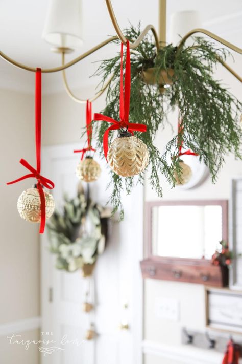 Gold ornaments hanging from chandelier with red velvet ribbon. Christmas Chandelier, Christmas Wired Ribbon, Tree Inspiration, Valentine's Day Wreath, Grey Christmas, Ribbon On Christmas Tree, Christmas Inspo, Festa Party, Valentine Day Wreaths