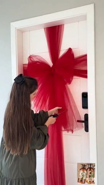 Cute Christmas Outdoor Decor, Christmas Bow On Door, Inexpensive Ways To Decorate For Christmas, Wrap Door Like Present, How To Decorate Front Door Entrance For Christmas, Diy Traditional Christmas Decor, Christmas Decor Ideas Office Desk, Christmas Decor Ideas Apartment Small, Apartment Porch Christmas Decor