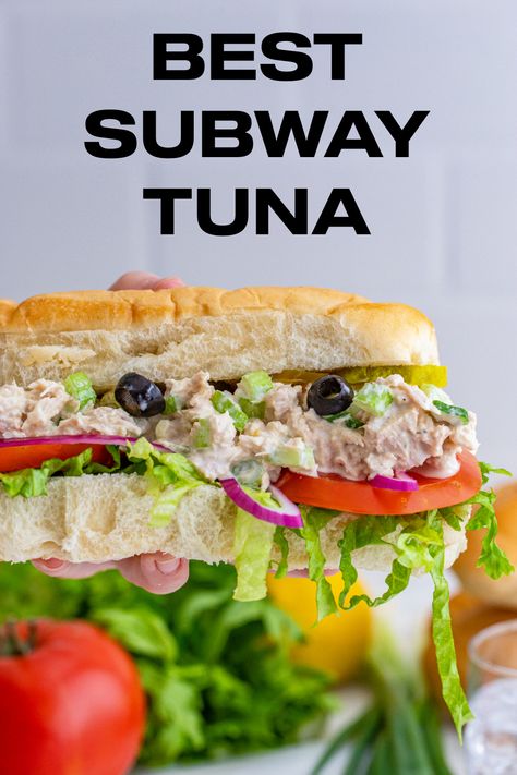 A Subway tuna sub being held in the air with tomatoes, olives, celery, onions and lettuce. Ultimate Tuna Sandwich, Copycat Subway Tuna, Subway Tuna Recipe, Subway Sandwich Ideas Copycat Recipes, Subway Tuna Recipe Copycat, Subway Tuna Salad Recipe, Tuna Subs, Tuna Sandwich Ideas, Best Subway Sandwich Ideas