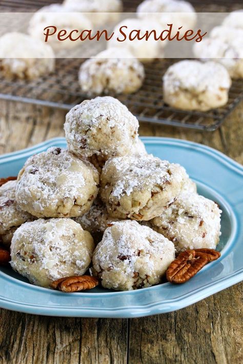 Pecan Sandies are a delicious Christmas treat that are a must make for any holiday cookie platter. I love the nutty crunch. The powdered sugar makes them all festive too with a kiss of “snow.” In fact, my daughter got all excited thinking it had somehow snowed in the house right on the cookies. This... Pecan Sandies Cookies, Sandies Recipe, Sandies Cookies, Classic Snowball Cookies, Mexican Wedding Cookies Recipes, Wedding Cookies Recipe, Pecan Snowballs, Pecan Snowball Cookies, Pecan Sandies