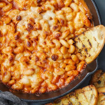 NYT Cooking - For those of you who love lasagna’s edges,... White Bean Tomato, Baked Tomato Recipes, Tomato Bake, White Bean Recipes, Bitter Greens, Mapo Tofu, Baked Tomatoes, Diner Recept, Nyt Cooking