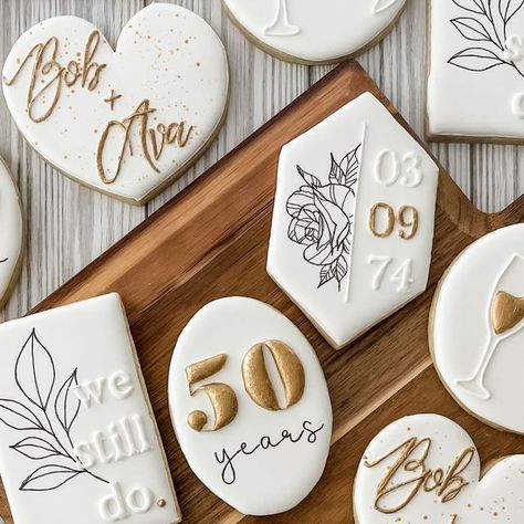 Leda Davis on Instagram: "Out of my element! Usually I’m asked to do birthdays and the occasional baby shower! But this is my 3rd request recently for anniversary/wedding sets. How did I do?!  Inspo: @ellascookiejar @sugarsbyshell   #anniversary #anniversarycookies #sugarcookies #cookie #cookies #royalicingcookies #royalicing #decoratedsugarcookies #decoratedcookies #cookiesofinstagram #houstonsugarcookies" 50 Th Anniversary Decorated Cookies, 60th Birthday Party Cookies, Anniversary Party Cookies, 40th Wedding Anniversary Cookies, Vow Renewal Cookies, Anniversary Cookies Ideas, 25th Wedding Anniversary Cookies, White And Gold Birthday Cookies, 40th Anniversary Cookies