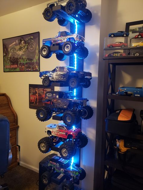 Big Truck Storage Kids Rooms, 2 Boy Room Ideas, Rc Car Storage Ideas Diy, Monster Jam Boys Bedroom, Monster Jam Kids Room, Monster Truck Toy Storage, Rc Storage Ideas, Boy Room Storage Ideas, Monster Truck Bedroom Ideas Boy Rooms