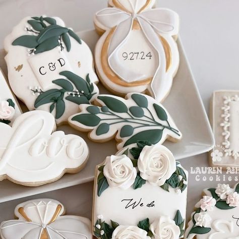 L A U R E N   A S H   C O O K I E S on Instagram: "Wedding cookies.. 🤩🥰 Sometimes they’re difficult to make, but when they turn out how you wanted.. 😍😍
I hope these were what the bride and groom had in mind. Congratulations Carissa & Dave! 🥂
.
.
.
.
.
.
.
.
.
#weddingcookies #weddingcookieset #bridecookies #bridalcookies #bridalshowercookies #weddingshowercookies #weddingringcookies #engagementcookies #sugarcookies #decoratedcookies #decoratedsugarcookies #cookiesofinstagram #cookiedecorator #cookieartist #sugarcookiesofinstagram #sugarcookieart #cookiegram #instacookies #flowercookies #floralcookies #royalicingflowers #greenerycookies" Royal Icing Wedding Cookies, Decorated Wedding Cookies, Wedding Cookies Decorated, Bride Cookies, Cookie Gram, Wedding Shower Cookies, Engagement Cookies, Bridal Cookies, Royal Icing Flowers