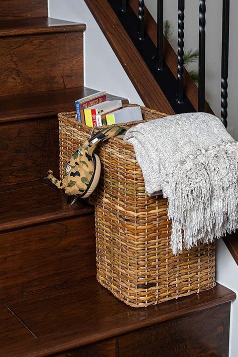 This unique-shaped woven wicker basket is designed to sit securely on two steps on your staircase to collect items like toys, clothes, books, mail, magazines, blankets, supplies, shoes, and an endless assortment of other little things throughout the day that eventually need to make a trip upstairs... all at once. Basket For Stairs, Stair Basket, Ceiling Curtain Track, Wicker Material, Shoe Organizer Entryway, Plastic Storage Totes, Stair Stickers, Storage Totes, House Stairs