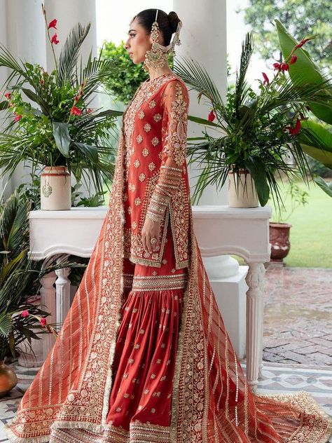 Luxury Red Sharara With Dabka Work, Luxury Anarkali Sherwani With Dupatta, Luxury Red Dupatta With Floral Embroidery, Luxury Red Sharara For Eid, Luxury Orange Dupatta For Wedding, Luxury Red Traditional Wear For Eid, Luxury Traditional Marriage Wear, Luxury Long Red Traditional Wear, Luxury Orange Wedding Dupatta