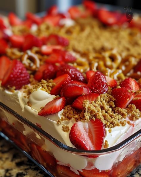 Looking for a show-stopping dessert? Try this Strawberry Crunch Cheesecake Delight! With a crunchy pretzel crust, creamy cheesecake layer, and fresh strawberry topping, it’s the perfect no-bake treat for any occasion. Easy to make and even easier to enjoy, this recipe is sure to be a hit at your next gathering. Click through for the full recipe and get ready to impress your family and friends! Cheesecake With Strawberries On Top, Strawberry Crunch Trifle, Strawberry Crunch Cheesecake: A No-bake Delight, Strawberry Crunch Cheesecake Delight, Strawberry Crunch Cheesecake Bites, Pretzel Strawberry Dessert, No Bake Strawberry Crunch Cheesecake, Strawberry Crunch Poke Cake, Strawberry Delight Dessert