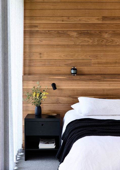 A simple monochromatic palette allows the timber feature wall to shine in this bedroom in a home on the Mornington Peninsula by Planned Living Architects. Photography: Derek Swalwell | Styling: Natalie James | Story: Belle Timber Feature Wall, Wall Behind Bed, Feature Wall Design, Feature Wall Bedroom, Timber Walls, Fa Fal, Cosy Room, Wallpaper Bedroom, Accent Walls