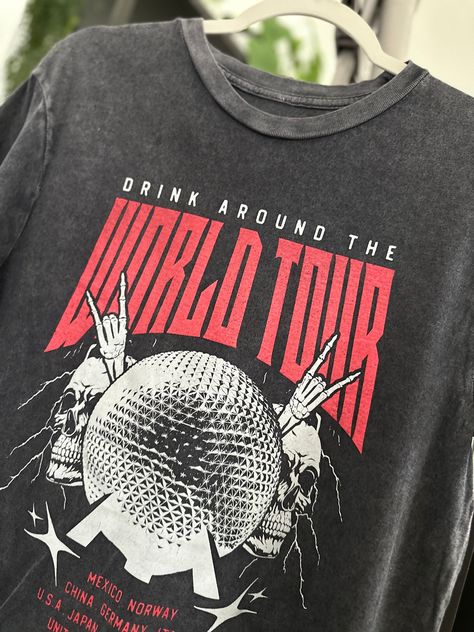 Drink Around The World - World Tour Vintage Black Tee! Featuring a vintage black rock tee design, this shirt showcases the iconic Epcot ball and highlights all the countries where you can indulge in delicious drinks. Get ready for a global adventure! World Tour Shirt Design, Tour Merch Design, Tour Tshirt Design, Tour Shirt Design, Epcot Ball, Svt Concert, Marathon Tee, Vintage Rock Shirt, Graphic Tees Street Style