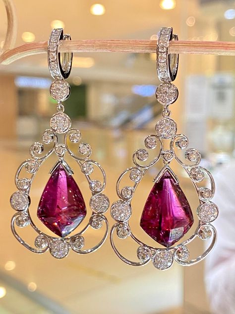 These earrings, glittery dangles are soooo beautiful. The stones are of amazing quality with a very desirable color. They have a deep red, pinkish, purple tones that will highlight any ear. These earrings are set to stun! The diamonds are of utmost quality in a whopping 3.32 Total Carat Weight!! These are dainty and delicate but super substantial at the same time. About Rubellite : Shape: Fancy Shield Weight: 22.24carats Hardness: 8.5 Color: Ruby Red About Diamond: Shape: Round Weight: 3.32cts C Dangle Diamond Earrings, Gold Jewellry, Diamond Shape Earrings, Golden Jewelry, Diamond Dangle Earrings, Tourmaline Jewelry, Magical Jewelry, Ruby Earrings, Fancy Jewelry