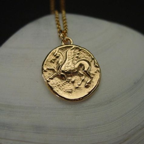 Small Percy Jackson necklace handmade from a Pegasus coin from ancient Greece.Pegasus the winged divine stallion is usually depicted as pure white in color. He was sired by Poseidon, in his role as horse-god, and foaled by the Gorgon Medusa.Greco-Roman poets write about his ascent to heaven after his birth and his obeisance to Zeus, king of the gods, who instructed him to bring lightning and thunder from Olympus.Popular character in games such as Dungeons and Dragons and Magic The Gathering.• Th Percy Jackson Jewelry, Percy Jackson Necklace, Lightning And Thunder, Gorgon Medusa, Ancient Roman Coins, Ancient Greek Coin, Greco Roman, Greek Coins, Greek Jewelry