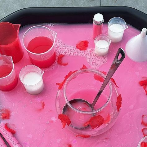 Natasha’s Tuff Trays on Instagram: "Love Potions 💕 
- Valentine’s Day inspired 
- Water play 
- Colour mixing 
- Creative and imaginative play

❤️ Potion base is created using water mixed with pink paint and glitter 
❤️ Red and white paint mixed with water in the beakers 
❤️ Love heart confetti and fake rose petals in containers and used as decorations 

#tufftray #tufftrayideas #tufftrayactivities #tufftrayinspiration #tufftrayplay #tufftrayfun #tuffspot #tuffspotideas #playtray #playtrayideas #sensoryplay #waterplay #eyfs #earlyyears #eytagteam #eyfsideas #letsshareourplay #inspiretheirearlyyears #learningwiththesmalls #playwithalbertandwilf #funbudgetplay #simpleplayforlittles #playactivitiesforfun #playideas #simpleplay #playinspiration #playactivities" Fake Rose Petals, Love Potions, Tuff Spot, Colour Mixing, Tuff Tray, Water Mixes, Pink Perfume, Heart Confetti, Beakers