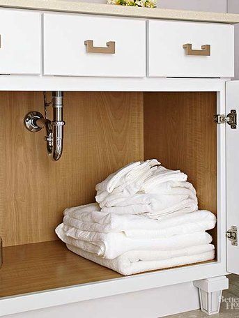 under sink storage Towels Under Bathroom Sink, Under Sink Storage Bathroom, Under Bathroom Sink Storage, Bathroom Towel Storage Ideas, Under Bathroom Sink, Small Bathroom Cabinets, Bathroom Under Sink, Under Cabinet Storage, Bathroom Sink Organization