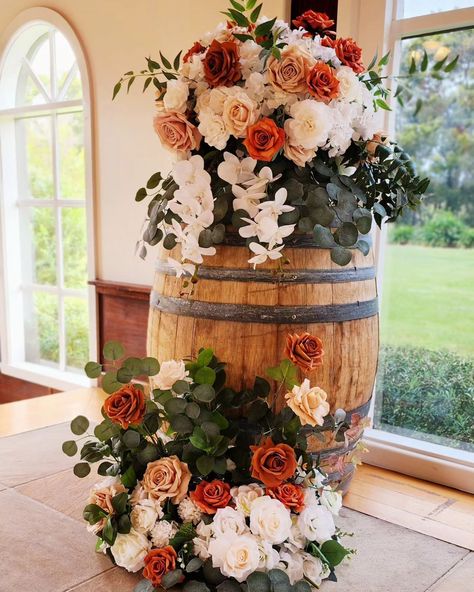 Ceremony backdrop for Abbie and Daniel. Congratulations you guys!!! The light-filled chapel at Immerse is the most beautiful place to say "I do" Wine barrel floral huggers never looked so good with the matching floor arrangements to tie it all together. Not to mention the pretty pew flowers we added. Stay tuned for our next post! #weddingflowersdecoration #flowersforwedding #luxuryweddingflowers #weddingfloristry #tablecentrepiece #eventflorals #weddingflorists #flowercenterpiece #flower... Barrel Centerpiece Wedding, Floral Arrangement On Wine Barrel, Wedding Wine Barrel Decor, Whisky Barrel Wedding Decor, Floor Arrangements, Barrel Wedding Decor, Wine Barrel Wedding, Wine Barrel Decor, Pew Flowers