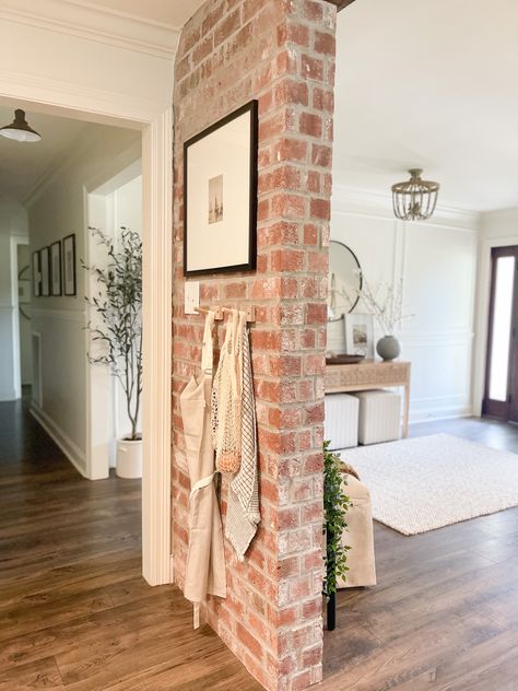 Entryway With Brick Wall, Entryway Brick Wall, Brick Wall Powder Room, Decor On Brick Wall, Brick Wall Entryway, Brick Wall Hallway, Brick Entryway Wall, Accent Wall Hallway, Brick Wall Kitchen