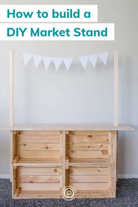 DIY market stand for dramatic play by Little Lifelong Learners. We're sharing how to make a simple DIY market stand for kids using Ikea crates! This DIY Ikea playroom hack is easy, inexpensive, and can be used to transform your play space into a farmers market, grocery store, bakery, donut shop, coffee shop, pizza shop, lemonaide stand, and more. Your kids will love engaging in imaginative play and play-based learning using this DIY market stand! Read the blog post to learn more! Shop Play Area For Kids, Play Shop Diy, Ikea Lemonade Stand, Playroom Market Ideas, Easy Shop Projects, Outdoor Play Shop, Ikea Market Stand Hack, Diy Play Shop, Diy Lemonade Stand Kids