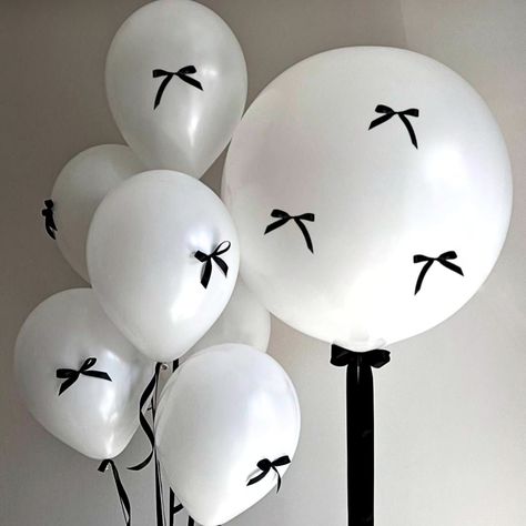 Enhance your birthday or bow party with these sophisticated balloons. Ideal for a Romantic themed celebration, girls' night, or any Coquette themed party. Create a stunning atmosphere by pairing them with our White or Black Numbers or Black Hearts or Stars for a professional-looking decor. Make your party unforgettable with these elegant balloons. Great for setting the scene as a Pro.  𝐂𝐡𝐨𝐜𝐤𝐢𝐧𝐠 𝐇𝐚𝐳𝐚𝐫𝐝: Children can choke or suffocate on uninflated or broken balloons. Adult Supervis Bows On Balloons, Bow Tie Birthday Theme, Trending Birthday Themes 2024, Birthday Bow Theme, Black Bow Themed Birthday Party, Black And White Birthday Theme Decoration, Bow Birthday Decor, Balloons With Bows, Coquette Balloons