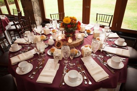 The reception tables were dressed in burgundy tablecloths with ivory napkins and dinnerware to create a cozy, warm sensation. Cocktail Table Decor, Sweets Table Wedding, Reception Head Table, Smith Wedding, Daughters Wedding, Pink Napkins, Table Scapes, Simple Wedding Cake, Sweet 16 Invitations