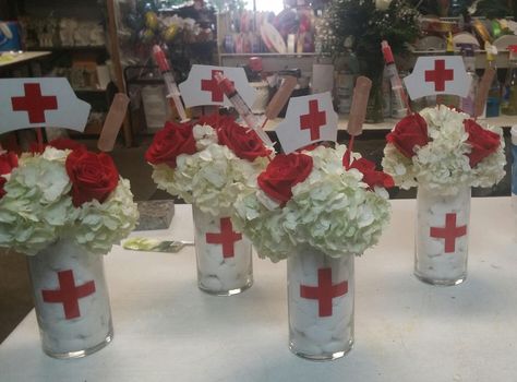 nurses retirement/graduation centerpieces Nurse Retirement Party Centerpieces, Nurse Graduation Centerpiece Ideas, Nursing School Graduation Party Ideas Centerpieces, Nursing Grad Party Centerpieces, Nurse Centerpieces Table Decorations, Nurse Graduation Party Centerpieces, Retirement Party Ideas For Nurses, Nurse Pinning Ceremony Decorations, Nursing Graduation Centerpieces