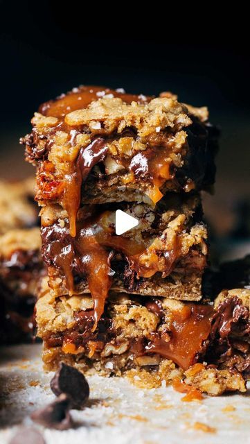 Jenna Barnard on Instagram: "These ooey gooey bars have a soft chocolate chip oat cookie crust, homemade salted caramel, rich dark chocolate, toasted nuts, and more cookie dough on top. They’re so rich in all the best ways 💕 full recipe is on my website! Titled “salted caramel chocolate chip oat cookie bars”" Gooey Chocolate Chip Cookie Bars, Salted Caramel Chocolate Chip Oat Cookie Bars, Gooey Salted Caramel Chocolate Chip Bars, Salted Caramel Choc Chip Cookie Bars, Coconut Toffee Chocolate Chip Cookie Bar, Oatmeal Chocolate Chip Cookie Bars, Caramel Cookies Bars, Fancy Desserts Recipes, Chocolate Chip Pecan Cookies