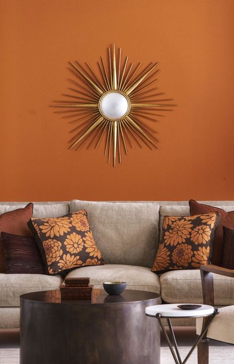 If you immediately picture a neon traffic cone when you think about orange, you're missing out. Cecilie Starin, a San Francisco-based interior designer, adores this rustic, burnt shade. "It adds a real warmth to rooms, while also adding a great pop to a space," she says. Burnt Orange Living Room Decor, Burnt Orange Paint, Burnt Orange Living Room, Orange Paint Colors, Furnitur Ruang Keluarga, Orange Rooms, Living Room Orange, Bedroom Orange, Living Room Color Schemes