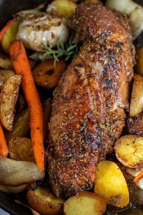 Easy honey mustard roasted pork tenderloin with potatoes and carrots is baked in the oven for a delicious family dinner. This oven baked pork tenderloin is flavorful, juicy and made in one pan! Juicy pork tenderloin with a honey mustard glaze gets oven roasted with perfectly seasoned potatoes and carrots.A complete family dinner ready in under in an hour and it gets baked in the same pan for easy clean up.I think pork is underrated.It can be overcooked so easily which makes it dry an… Pork Loin Roast Dijon Mustard, Pork Roast Vegetables, Pork Tenderloin Recipes In Oven With Potatoes And Carrots, Half Loin Roast Recipes, Pork Tenderloin Honey Mustard, Porktenderloinrecipes Oven, Oven Roasted Pork Tenderloin With Vegetables, Mustard Glazed Pork Tenderloin, Autumn Pork Tenderloin