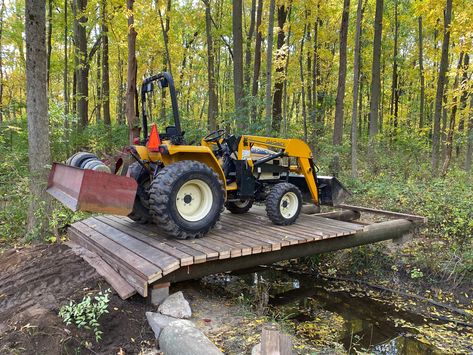 How To Build A Garden Bridge, Atv Bridge Over Creek, Diy Creek Bridge, Creek Bridge Ideas, Bridges Over Creeks, Diy Bridge Over Creek, Ditch Bridge, Atv Bridge, Bridge Over Creek