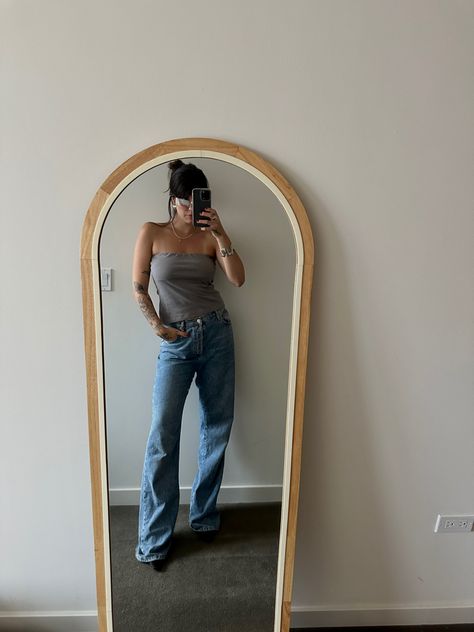 Woman wearing 90s inspired gray tube top, wide leg blue jeans Gray Tube Top Outfit, Grey Tube Top Outfit, Tube Outfit, Flowy Tube Top, Grey Tube Top, Tube Top Outfit, Tube Top Outfits, 90s Outfit, Top Outfit