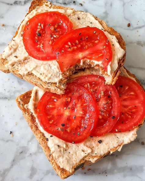 Forks Over Knives on Instagram: “It's tomato season! Paired with hummus and whole grain toast, we love this simple way to highlight a seasonal favorite.🍅⁠ ⁠ 📷:…” Butter On Toast, Hummus Toast, Vegan Bowl Recipes, Tomato Toast, Bowls Recipes, Tomatoes On Toast, Flexitarian Diet, Vegan Snack Recipes, Tomato Season