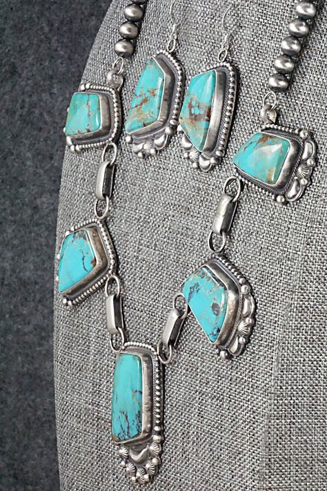 This Kingman turquoise and sterling silver necklace and earrings set was made by Navajo silversmith Tom Lewis. The back is signed Tom Lewis and stamped sterling.Necklace: 17"Height: 1 5/8"Width: 1"Earrings:Length: 1 7/8"Width: 1"Free shipping on all orders! We ship with USPS and always include tracking. All orders ship within a day of payment.Returns are accepted up to 30 days after you receive your order. Just send us a message. Our shop offers cash back or store credit. The item must be return Western Turquoise Jewelry, Tom Lewis, Vintage Turquoise Jewelry, Turquoise Stone Jewelry, Sterling Silver Turquoise Earrings, Glow Jewelry, Sterling Necklace, Silver Turquoise Jewelry, Turquoise Jewelry Native American